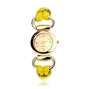 Zapestna ura, pašček iz rumenega lateksa, okrogla številčnica zlate barve