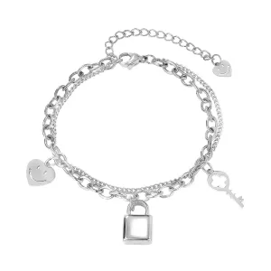 Jeklena zapestnica v srebrni barvi - srce s smeškom, ključavnica in ključ, dvojna verižica