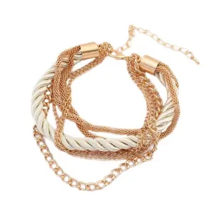 Zapestnica - spiralno zvita bisernata vrvica, verižice v zlati barvi